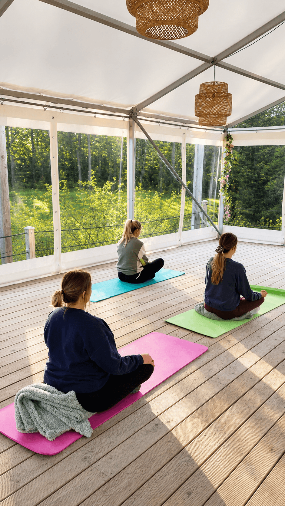 Yoga practice inside Ballyburren's waterside marquee